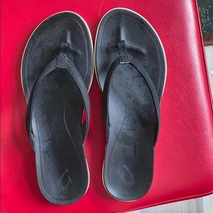 Olukai black flip flops